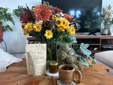What most Saturday mornings look like from my couch: a fresh bouquet, a warm cup of tea, a displaced houseplant that’s just been watered.